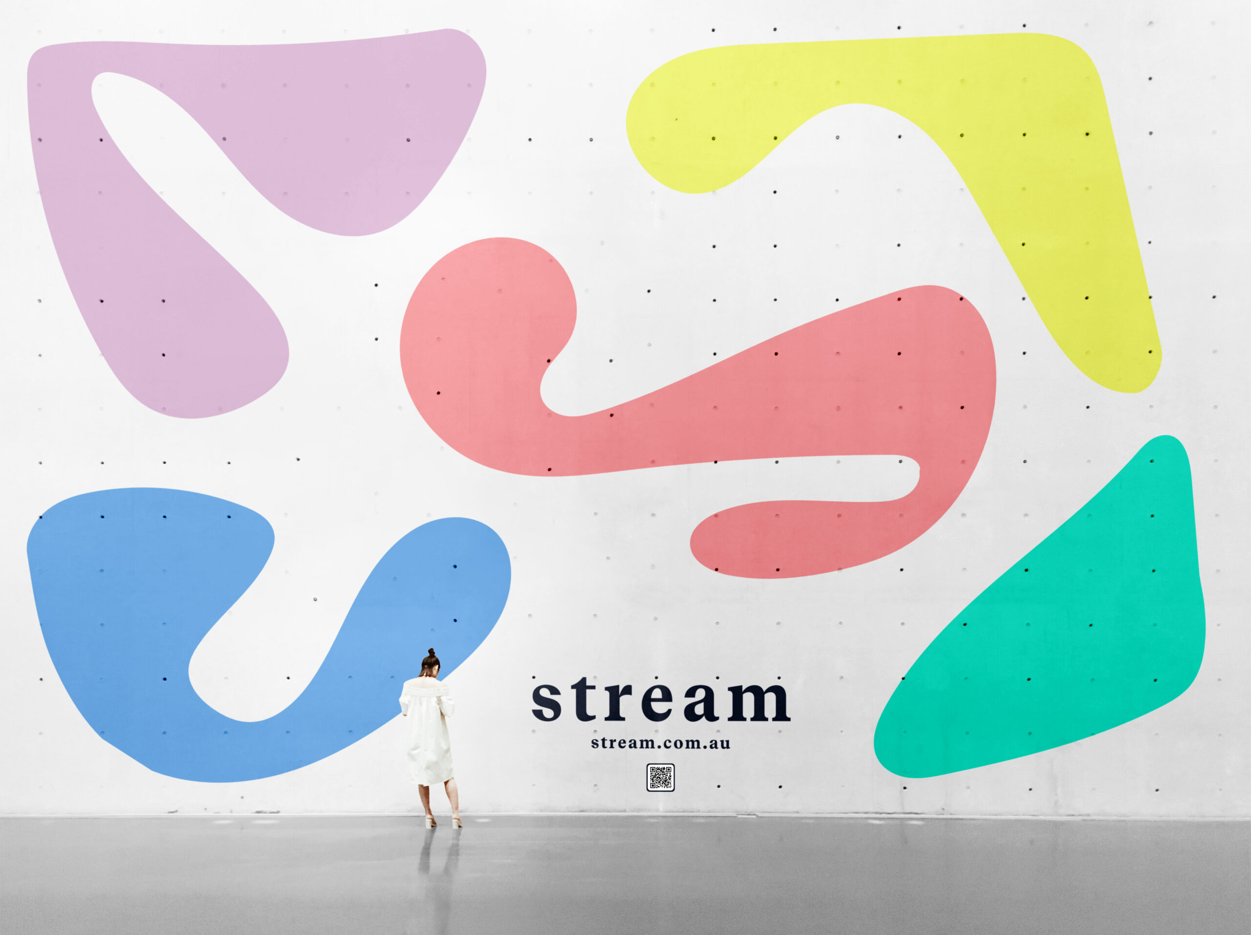 Stream wall installation, brand shapes in a pattern on a concrete wall