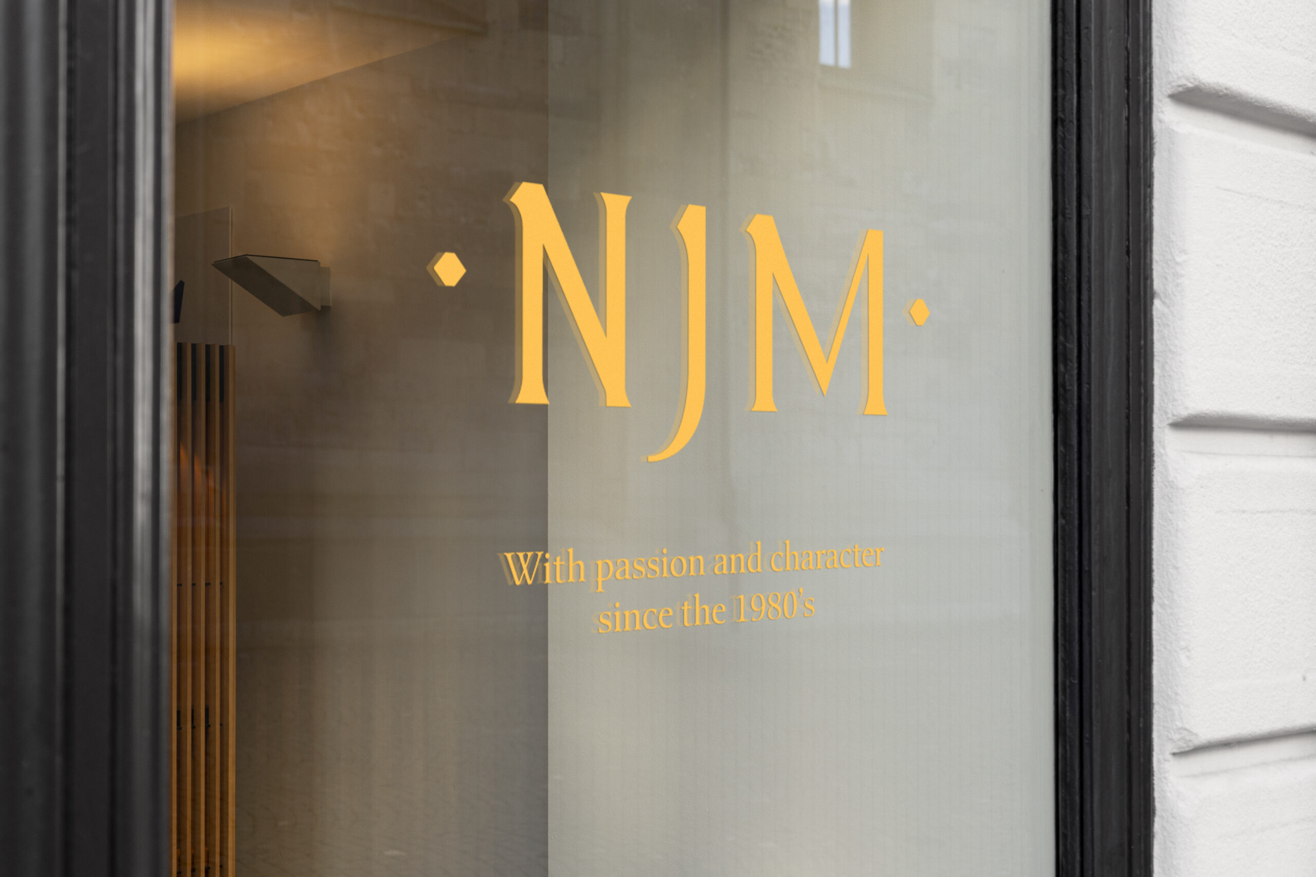 NJM Window signage (logo on glass)